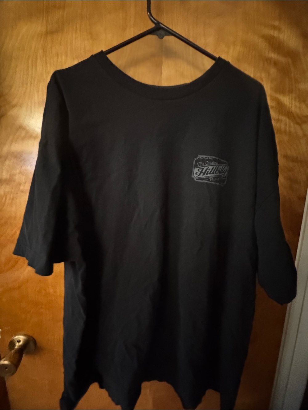 Black Short-Sleeve Graphic Tee with Chest Emblem